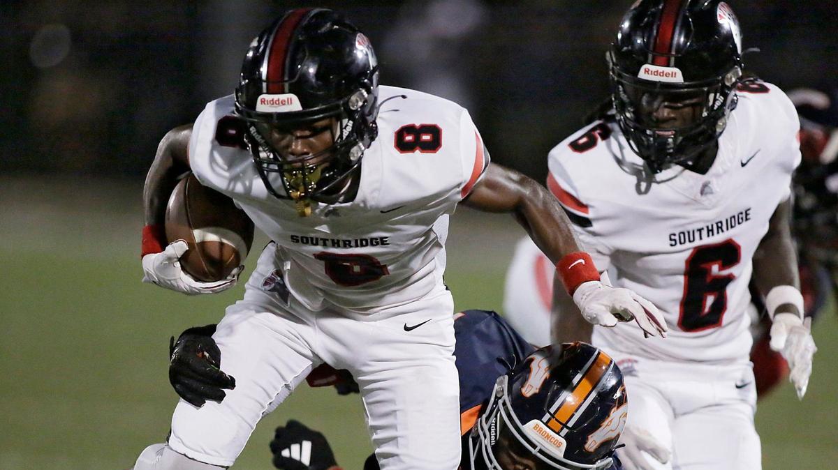Southridge Spartans wide receiver Darius Clements (8) breaks free from Homestead Broncos defender during football game on Friday, September 27, 2024 at Harris Field Park in Homestead.