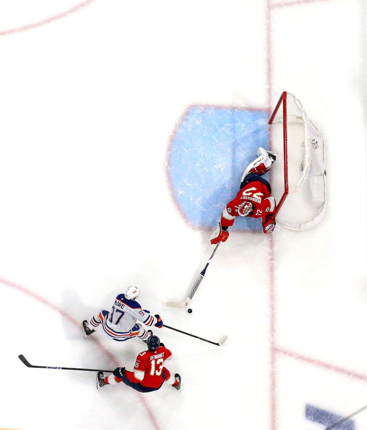 Florida Panthers goaltender Sergei Bobrovsky (72) stops a shot by Edmonton Oilers center Connor McDavid (97) during the first period of Game 6 in the Stanley Cup Final at Amerant Bank Arena on Tuesday, June 17, 2025, in Sunrise, Fla.