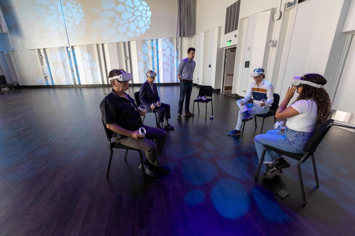 Jeffrey Buchman, Associate Professor and Stage Director for Opera at the Frost School of Music, second from right, demonstrates the use of virtual reality in a class he teaches inside the Hormel Innovation Stage.