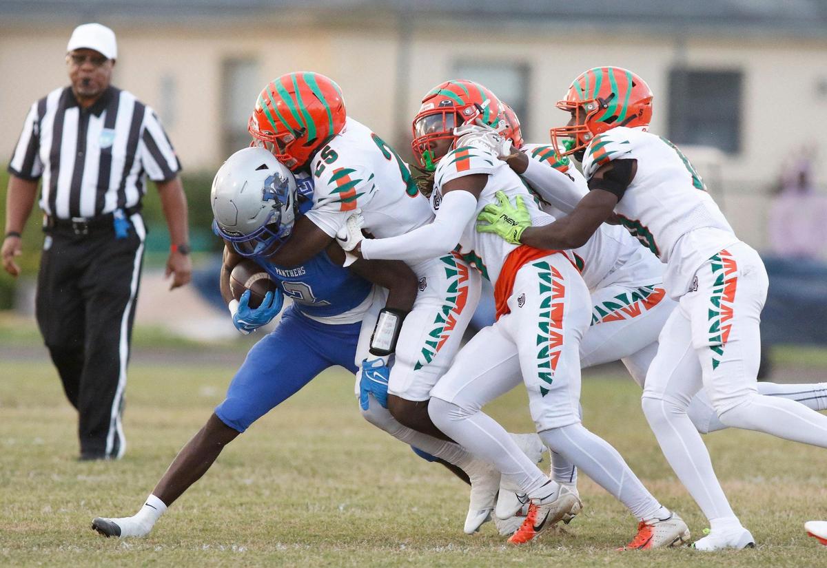 Blanche Ely Tigers defenders tackle Dillard Panthers running back Christopher Johanson during football playoff game on Saturday, November 19, 2022 at Dillard HS in Fort Lauderdale. Andrew Uloza / for Miami Herald