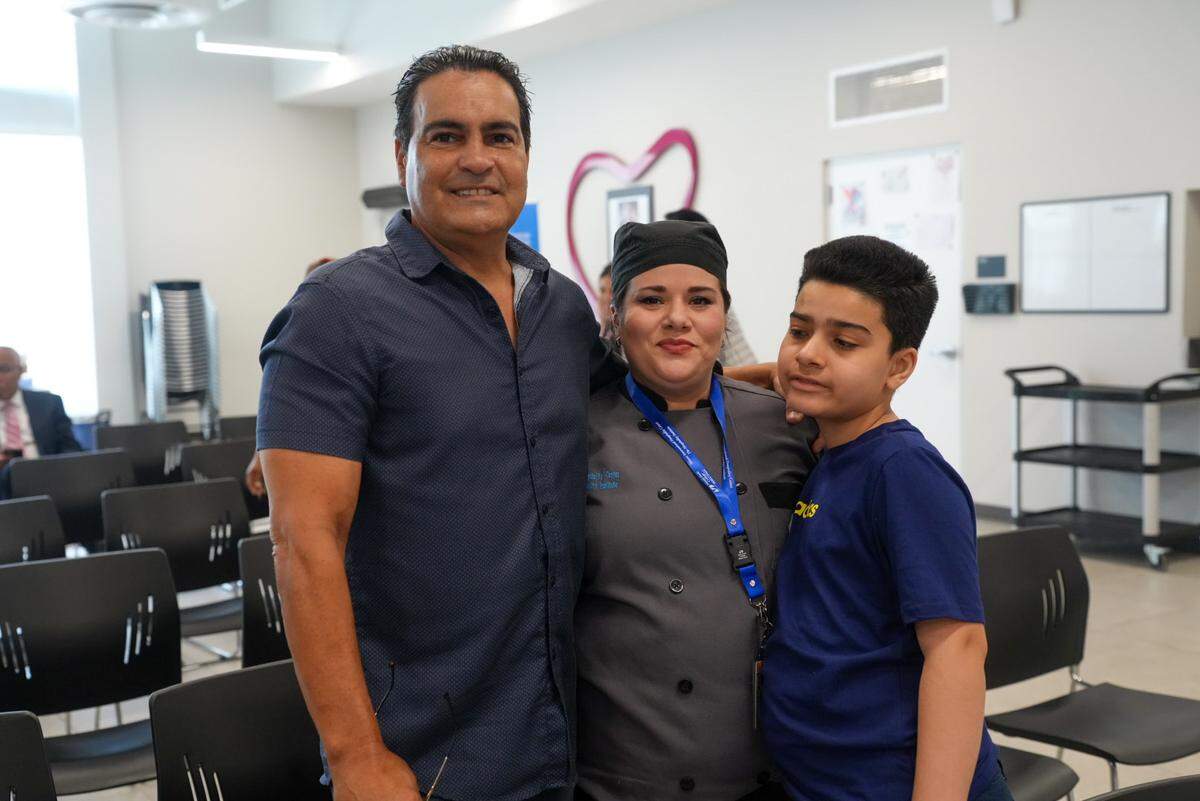 Ana Leon-Trujillo celebrates graduation and new culinary skills with her husband and son.