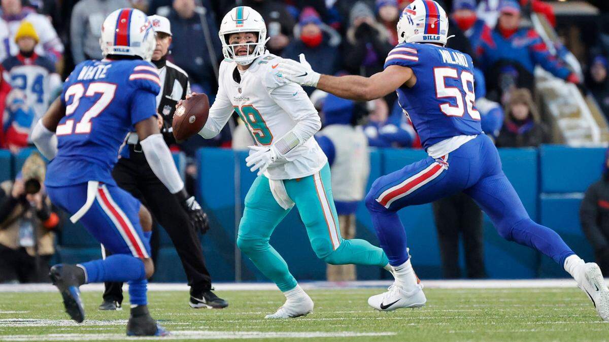 Miami Dolphins quarterback Skylar Thompson (19) looks to pass as Buffalo Bills cornerback Tre’Davious White (27) and linebacker Matt Milano (58) defend in the fourth quarter of the NFL wild-card football game at Highmark Stadium, Orchard Park, NY, on Sunday, January 15, 2023.
