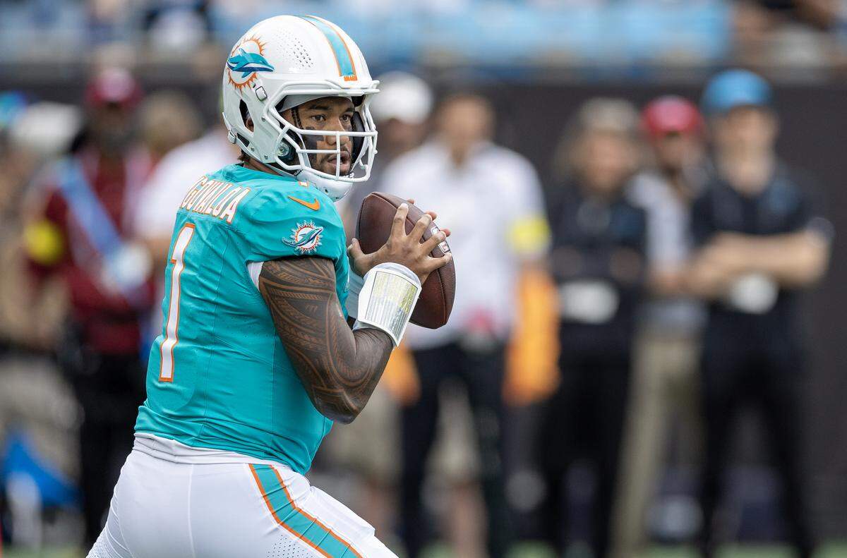 Miami Dolphins quarterback Tua Tagovailoa (1) set up to pass in the first half of their NFL game against Carolina Panthers at the Bank of America Stadium on Sunday, Oct. 5, 2025, in Charlotte, N.C.