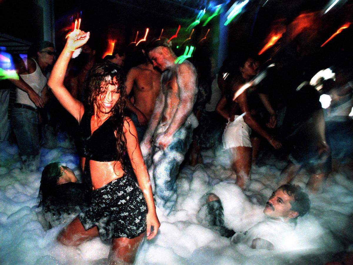 Club goers dance during one of the famed foam parties at the open-air club Amnesia, 136 Collins Ave., in the mid-1990s.