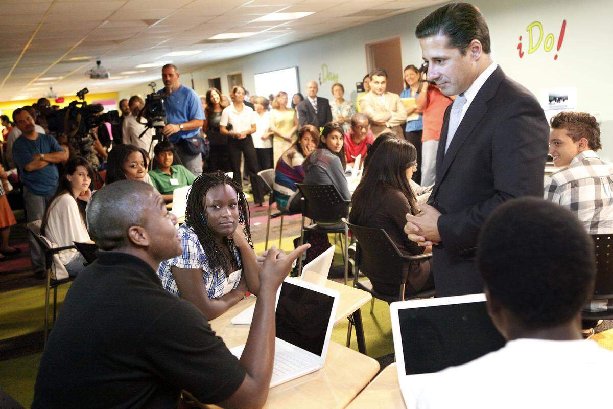 iPrep Academy junior Christopher Barnes, of Miami, left, gestures animatedly as he talks with Miami-Dade Schools Superintendent Alberto Carvalho on Monday, the first day of the 2010-2011 school year. Carvalho founded iPrep, 1500 Biscayne Blvd., in 2010. It now goes from pre-K to 12th grade.