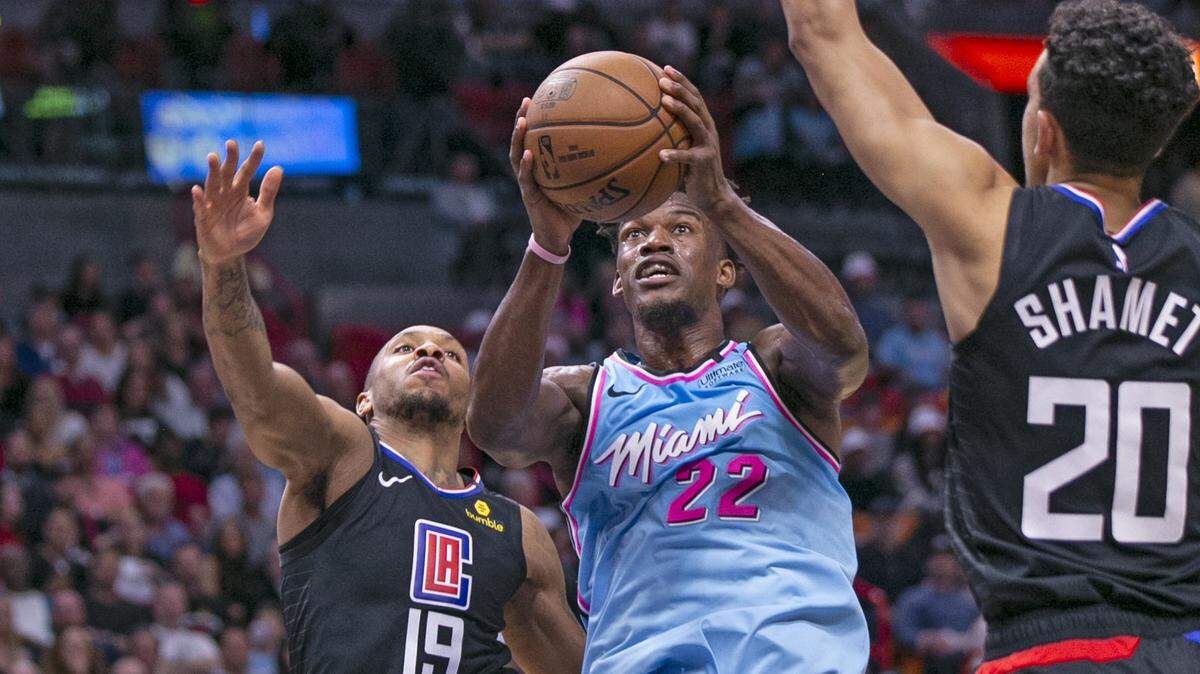Miami Heat forward Jimmy Butler (22) shoots from under the basket in the first quarter as the Miami Heat host the LA Clippers at the AmericanAirlines Arena on Friday, January 24, 2020.