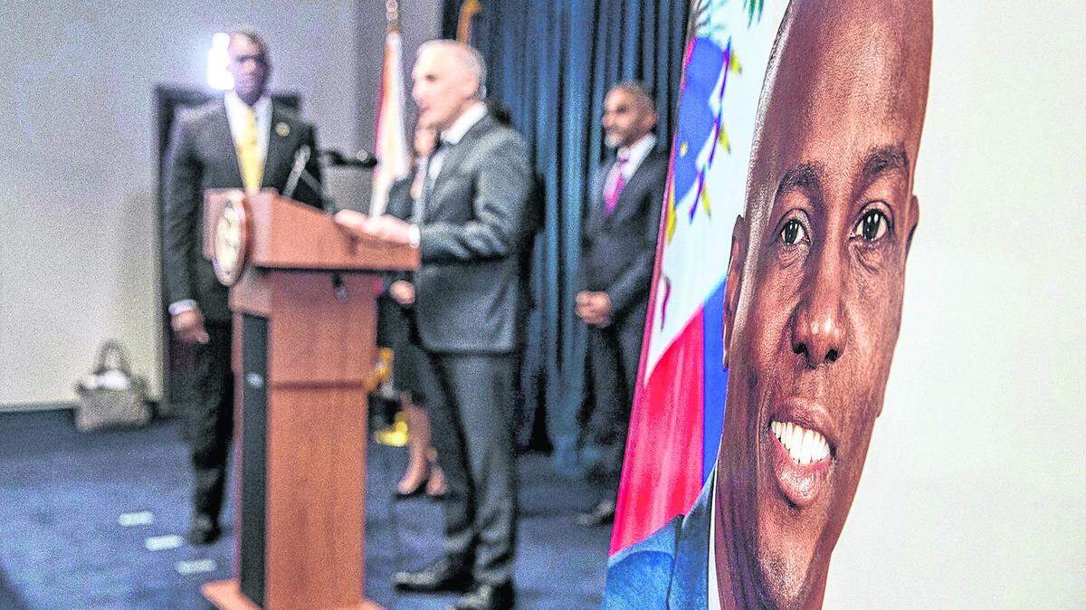In this file photo: Assistant Attorney General Matthew G. Olsen (on podium) of the Justice Department's National Security Division joined the U.S. Attorney Markenzy Lapointe (far left) as they announce significant developments in the U.S. government's prosecution of individuals allegedly connected to the assassination of Haitian President Jovenel Moïse on July 7, 2021.