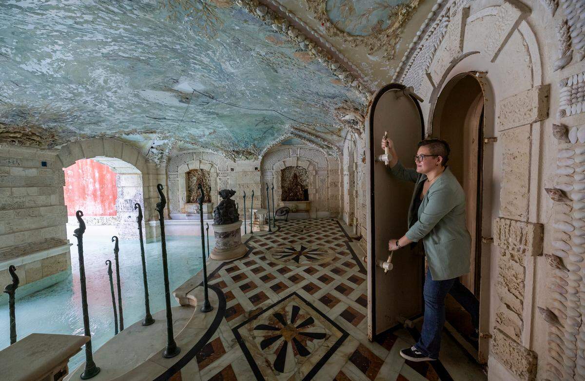 Davina Kuh Jakobi, the lead conservator at Vizcaya Museum and Gardens, enters the grotto and swimming pool area of the property. Vizcaya received $750,000 from the National Park Service’s Save America’s Treasures grant program to restore Robert Winthrop Chanler’s 107-year-old ceiling mural.