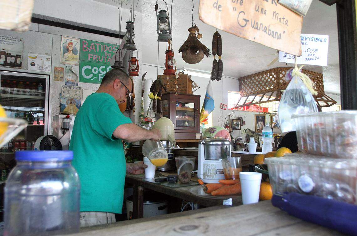 Owner Angel Hernandez makes a drink at Los Piñarenos Fruteria.