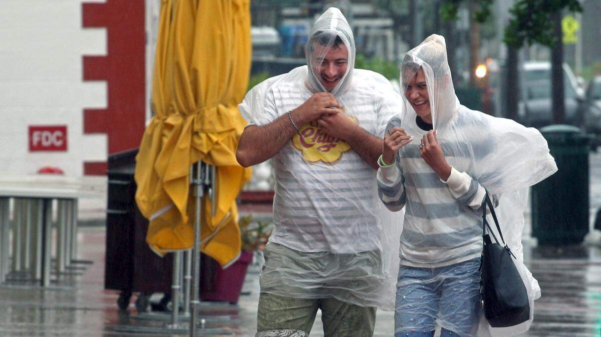 South Beach tourists brave the bad weather as many strolled down the empty sidewalks, checked-in or departed their hotels on Ocean Drive as a tropical storm warning was issued for coastal Miami-Dade with a wind gust to 45 miles per hour and heavy rainfall for the Labor Day holiday.