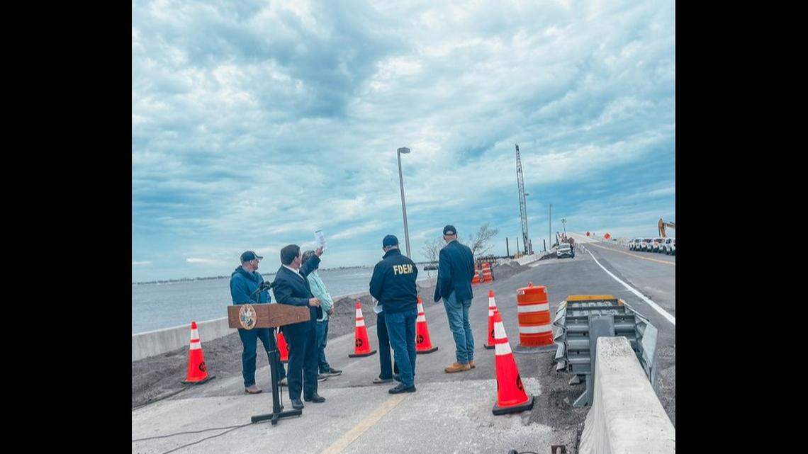 Kevin Guthrie, director of the Florida Division of Emergency Management, posted an image to Twitter of state officials, including Gov. Ron DeSantis, on the soon-to-open Sanibel Causeway on Oct. 19, 2022. The bridge, damaged by Hurricane Ian on Sept. 28, opened to emergency crews a week earlier and to the public at 11 a.m. Oct. 19.