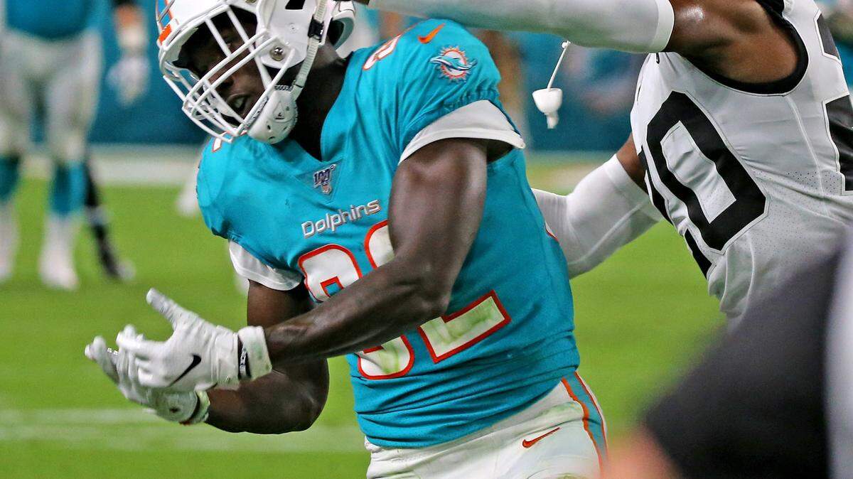 Miami Dolphins wide receiver Preston Williams (82) drops a pass as Jacksonville Jaguars Jalen Ramsey (20) defends at Hard Rock Stadium in Miami Gardens, Florida, Thursday, August, 22, 2019.