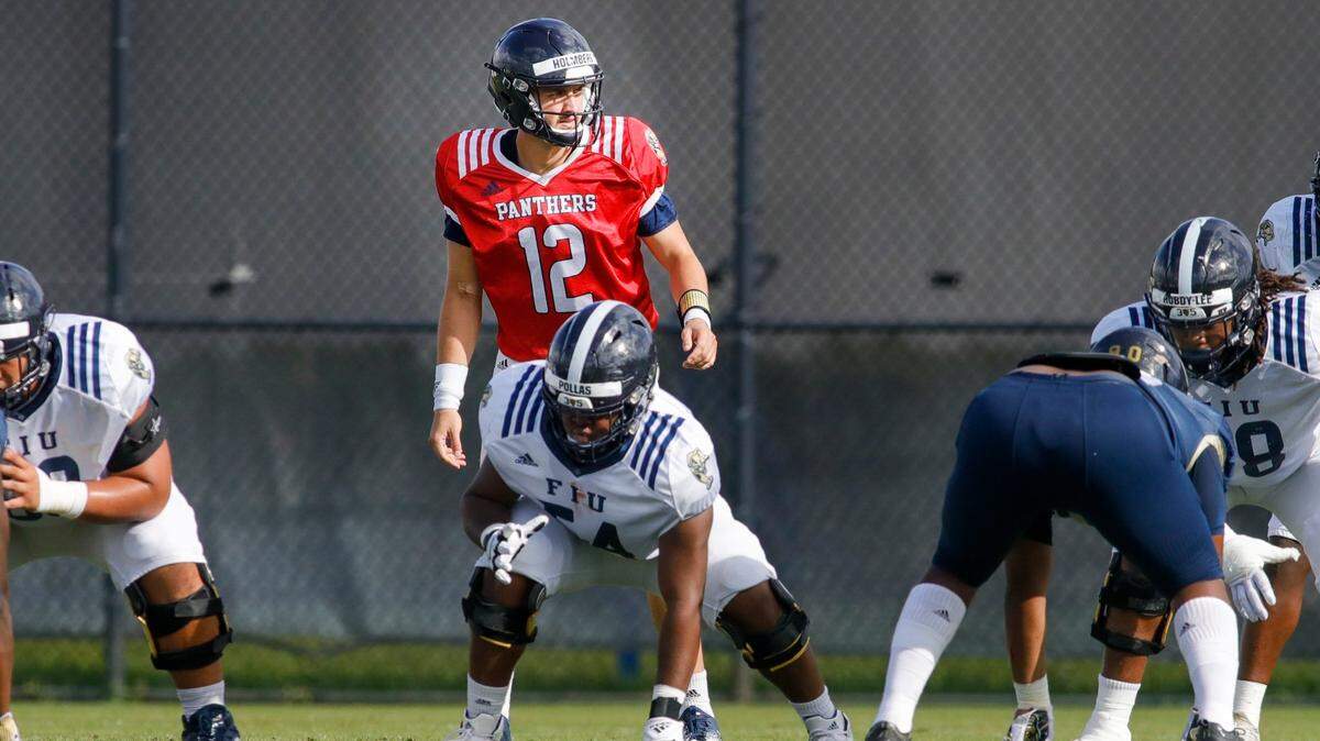 Florida International University quarterback Gunnar Holmberg (12) watches prior the snap during football practice at the practice fields at Florida International University in Miami, Florida, on Thursday, March 24, 2022.