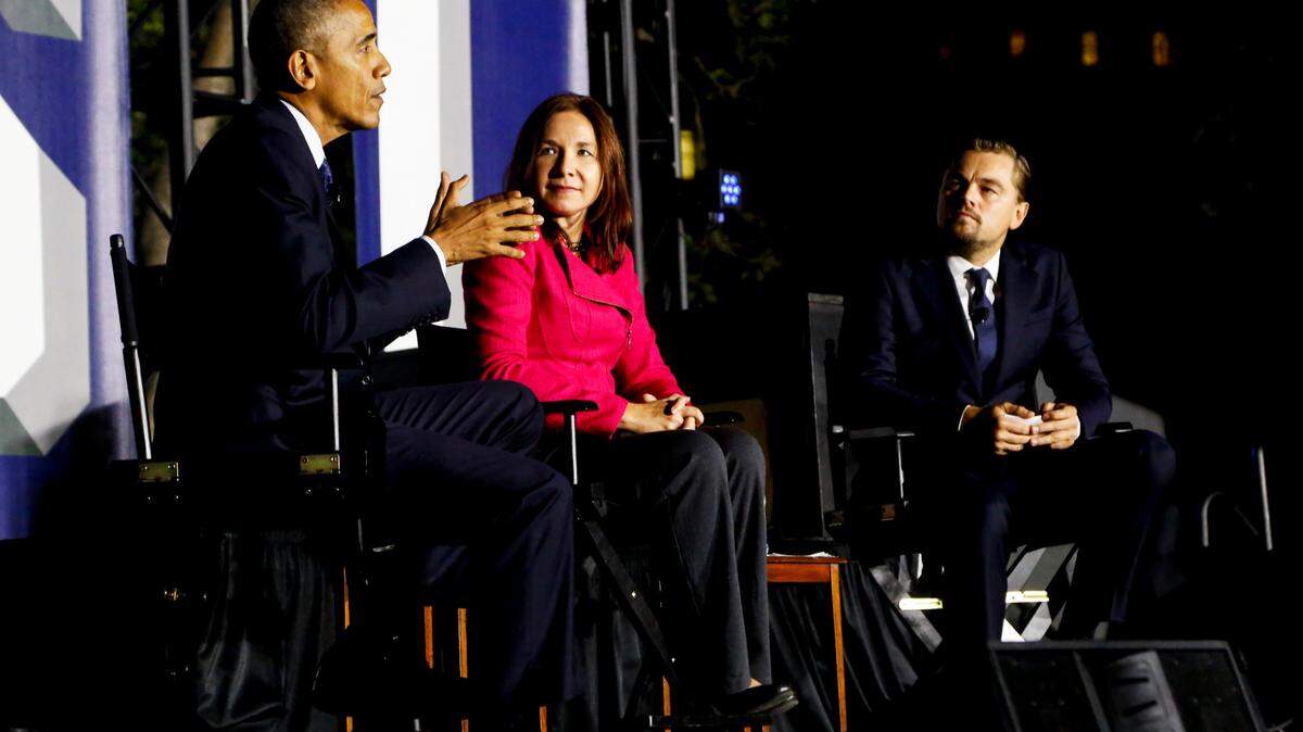 U.S. President Barack Obama and Leonardo DiCaprio flank Dr. Katharine Hayhoe at a panel discussion on climate change as part of the White House South in 2016. (Pool/Aude Guerrucci)
