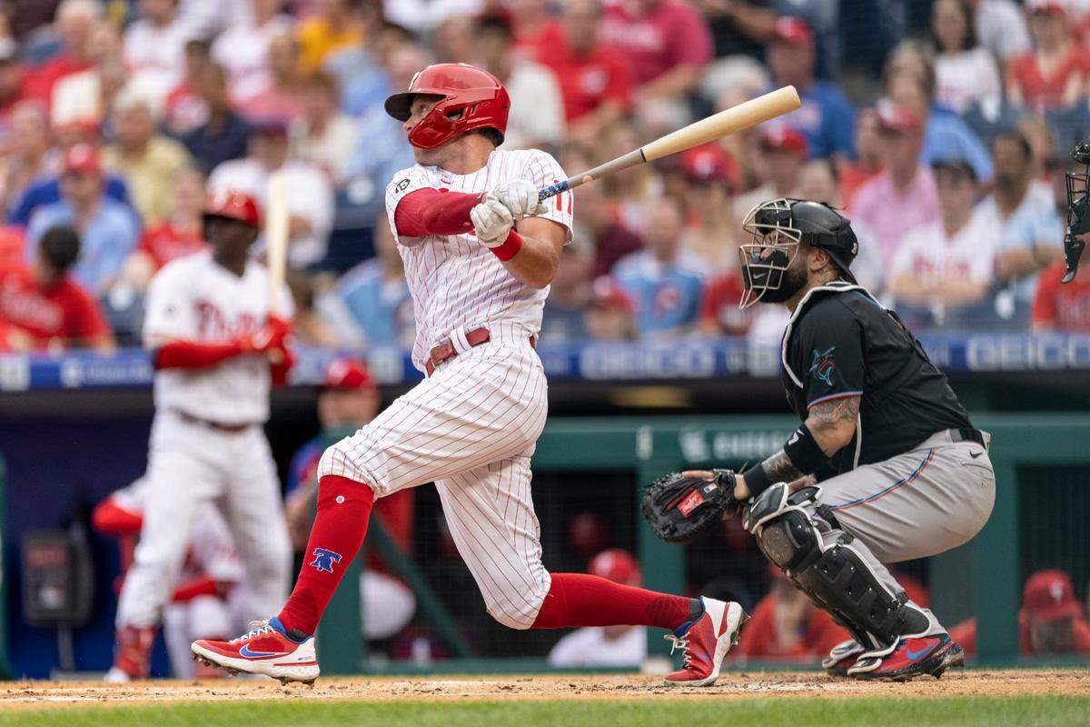 Philadelphia Phillies’ Rhys Hoskins follows through on an RBI single during the first inning of the team’s baseball game against the Miami Marlins, Saturday, July 17, 2021, in Philadelphia. (AP Photo/Laurence Kesterson)