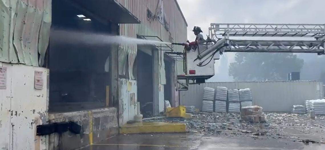 Miami-Dade Fire Rescue crews continue to douse a warehouse fire on Saturday, March 7, 2026, at 20600 NW 47th Ave.