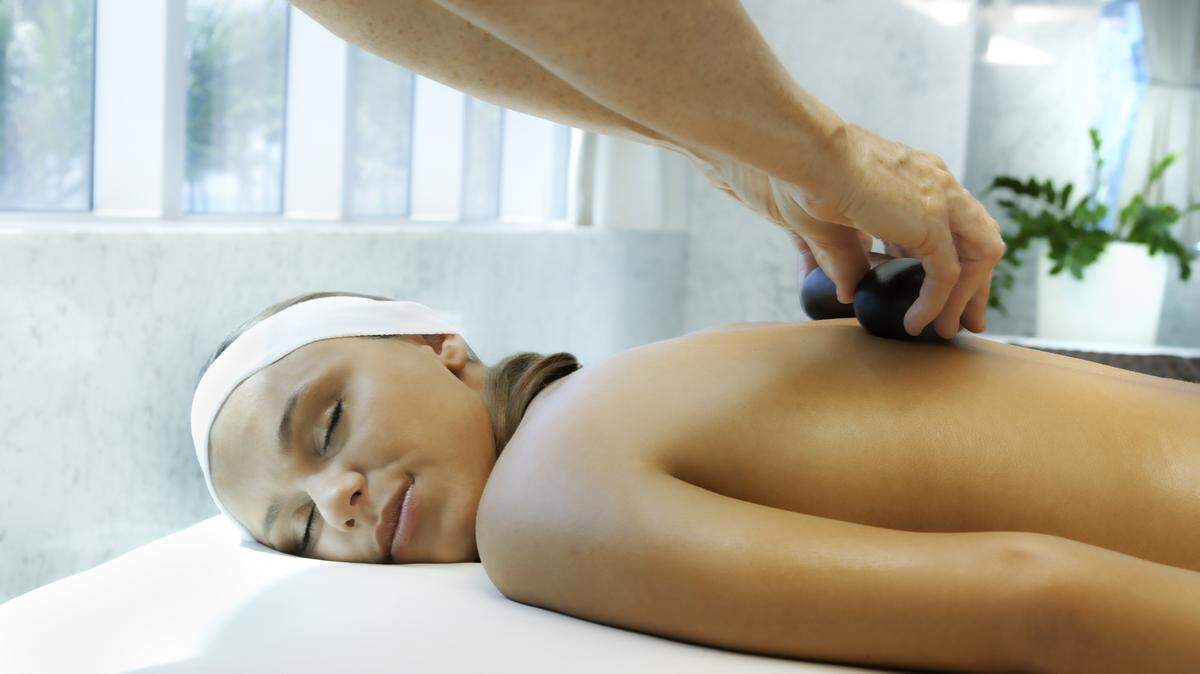 Having someone lay hot stones on your back is the antidote for driving on the Palmetto.