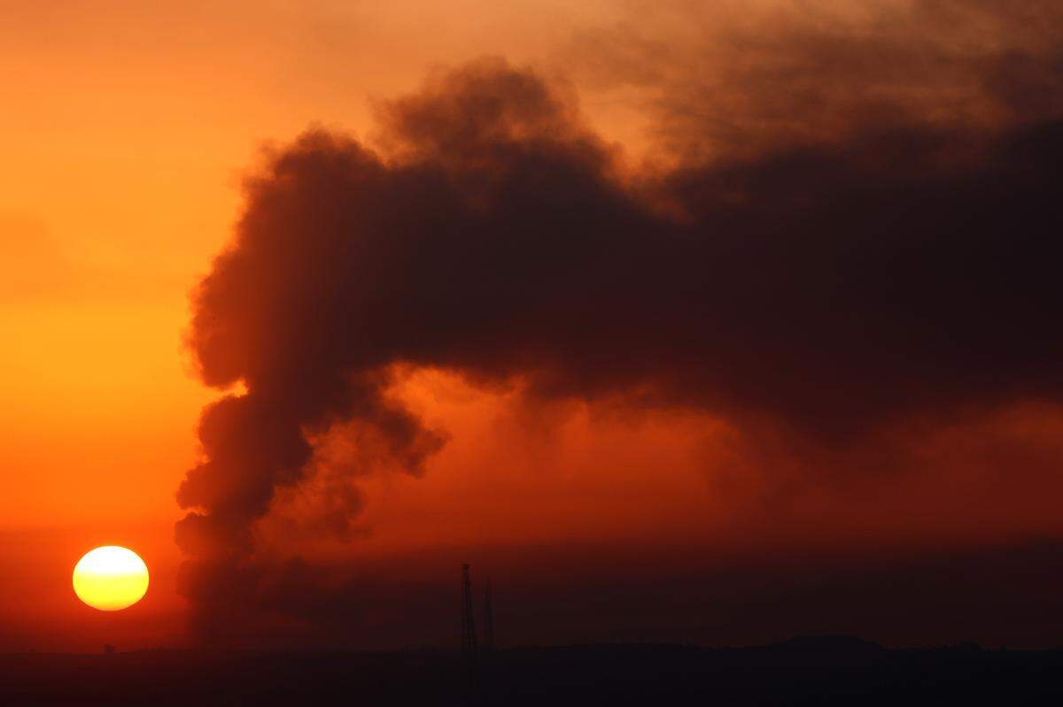 Smoke rises from damaged buildings in the Gaza Strip as seen from southern Israel, on Jan. 2.