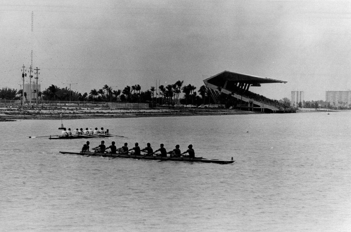A rowing regatta runs through the waters of Biscayne Bay near Miami marine Stadium.