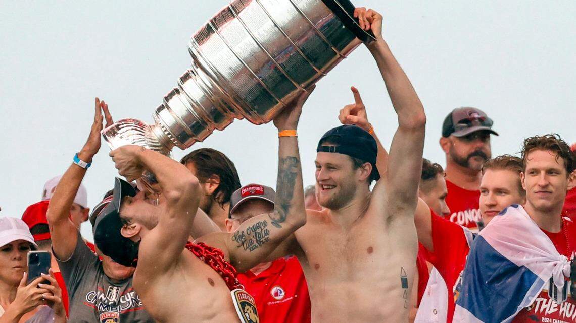 Florida Panthers center Steven Lorentz (18) helps Florida Panthers right wing Vladimir Tarasenko (10) drink out of the Stanley Cup during the Florida Panthers Stanley Cup victory rally along A1A in Fort Lauderdale, Florida on Sunday, June 30, 2024.