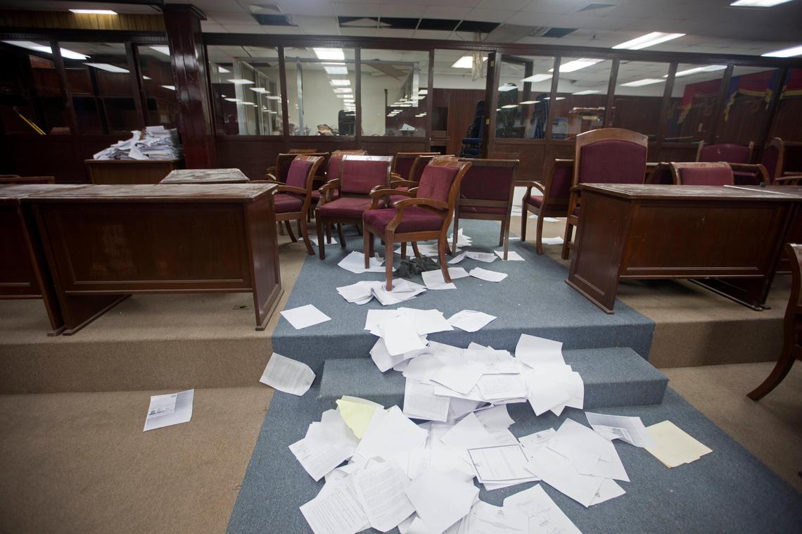 Documents lay on the floor of Parliament after it was ransacked by opposition lawmakers in Port-au-Prince, Haiti, Tuesday, Sept. 3, 2019.