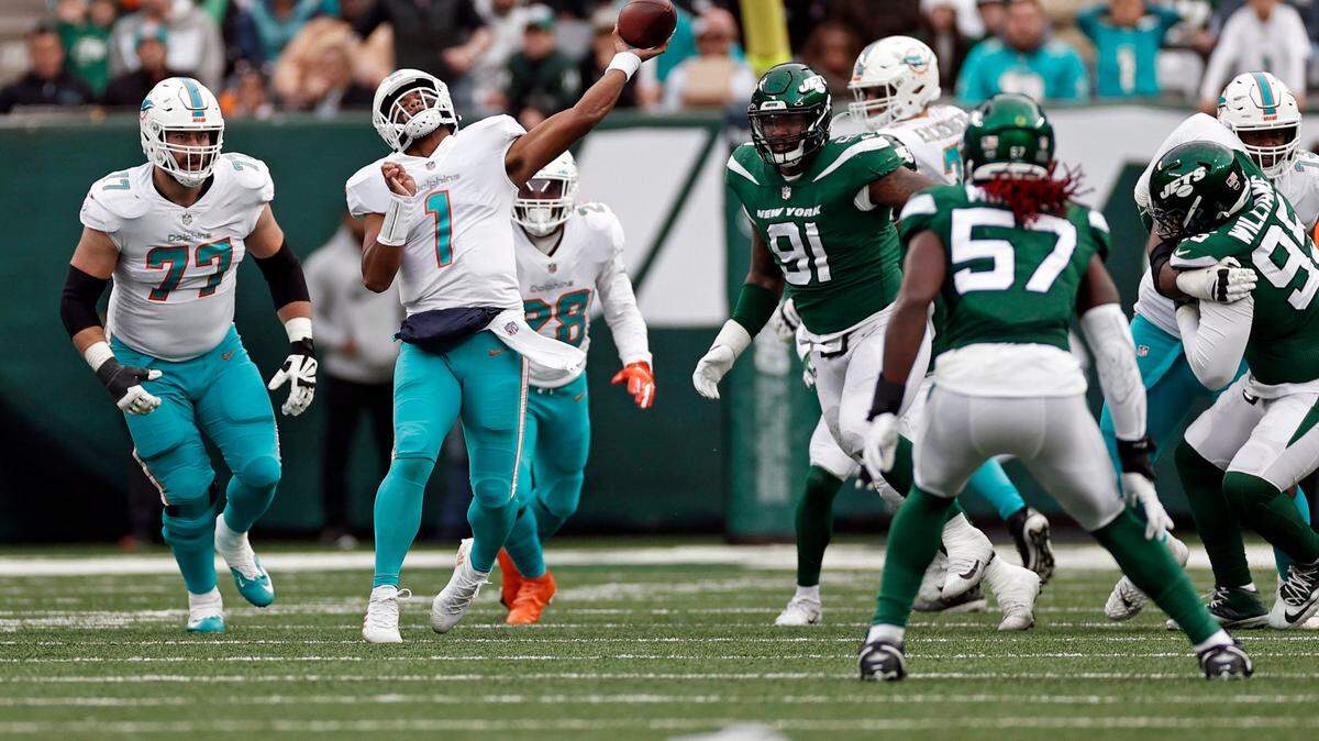 Miami Dolphins quarterback Tua Tagovailoa (1) passes against the New York Jets during an NFL football game, Sunday, Nov. 21, 2021, in East Rutherford, N.J. (AP Photo/Adam Hunger)