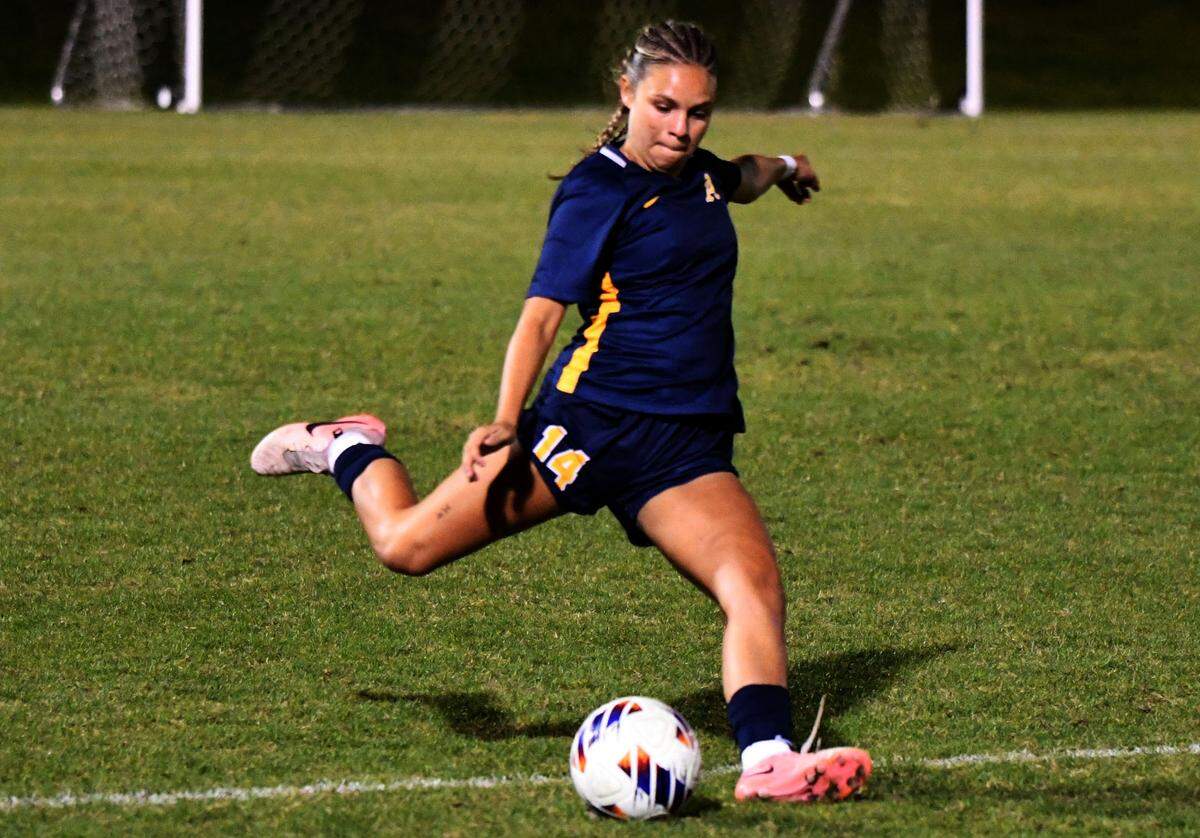 St. Thomas Aquinas junior Bianca Raskin (14) unleashes a hard shot during the Class 6A girls soccer state championship game against St. Johns Bartram Trail on Saturday at Lake Myrtle Sports Complex.