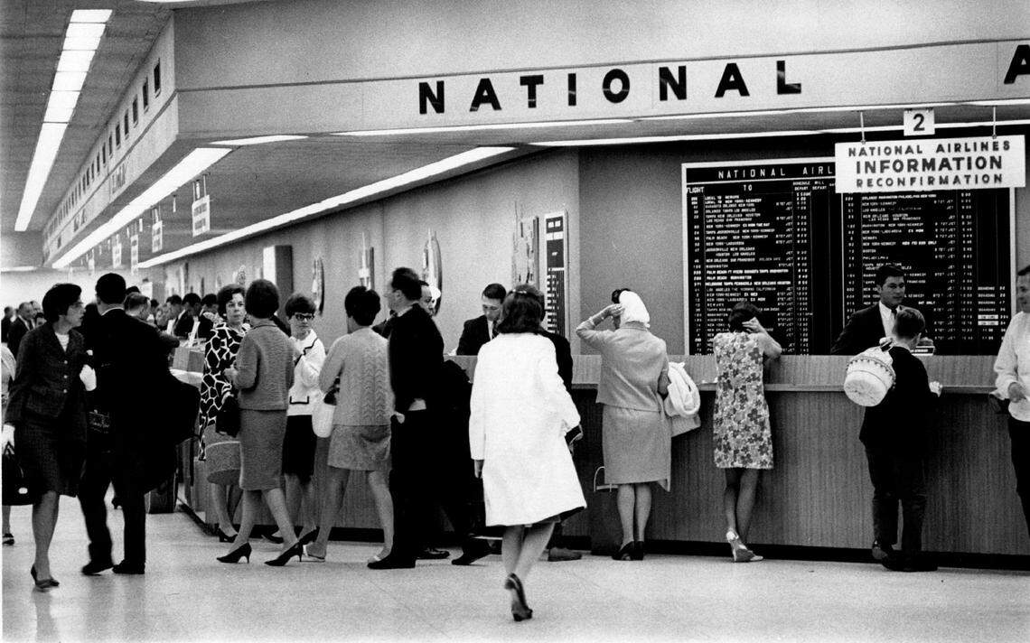 Travelers at the National Airlines ticket counter at the Miami airport in 1967.
