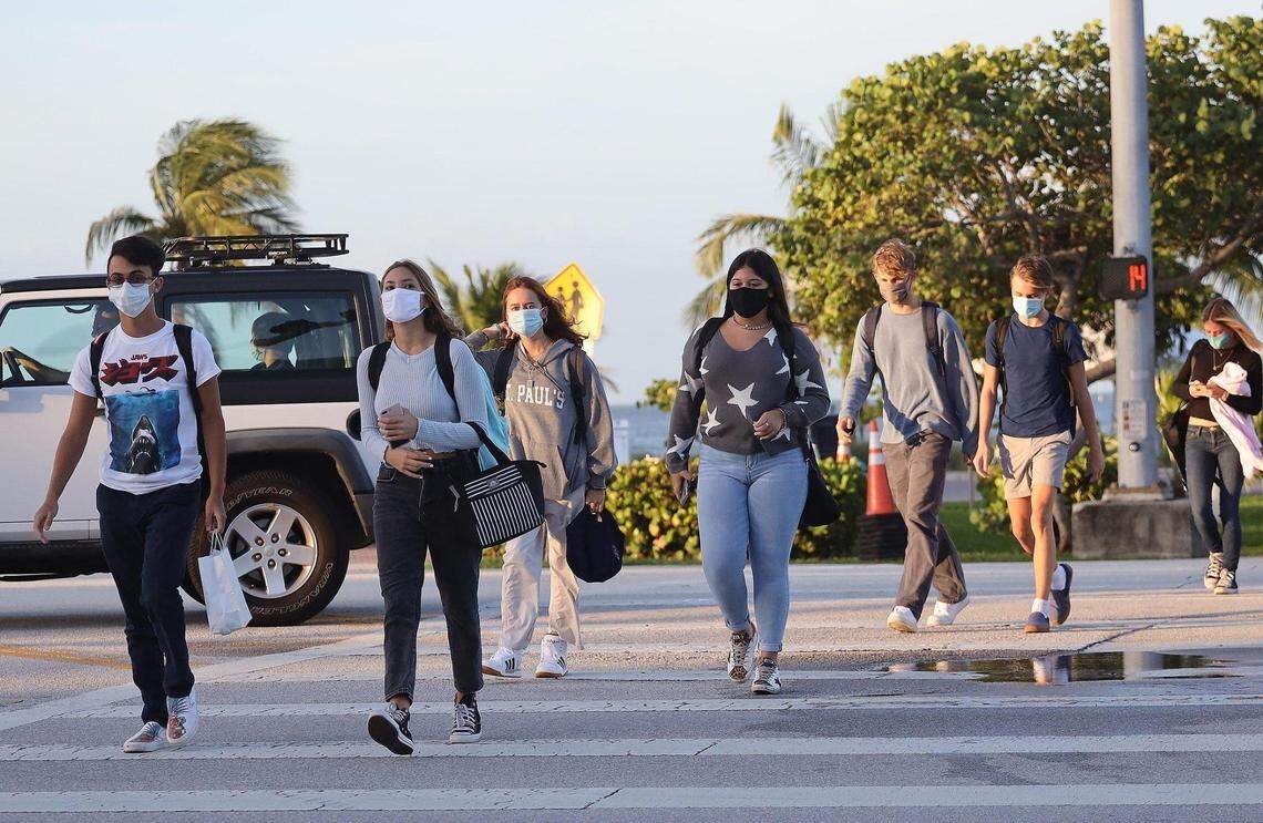 Students walk to the MAST Academy on the first day back of in-person learning, Wednesday, Oct. 7, 2020. On Monday, Nov. 1, 2021, Miami-Dade Schools Superintendent Alberto Carvalho announced parents of high school and traditional middle school students can opt out of mandatory masks for their children. Elementary school students and students in K-8 Centers still must wear masks.