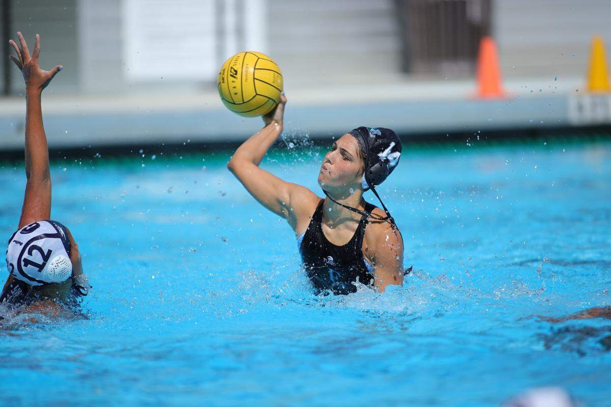 Ransom Everglades’ Holly Alesandro prepares to take a shot at Gulliver’s goal during Tuesday afternoon’s water polo regional final at Ransom.
