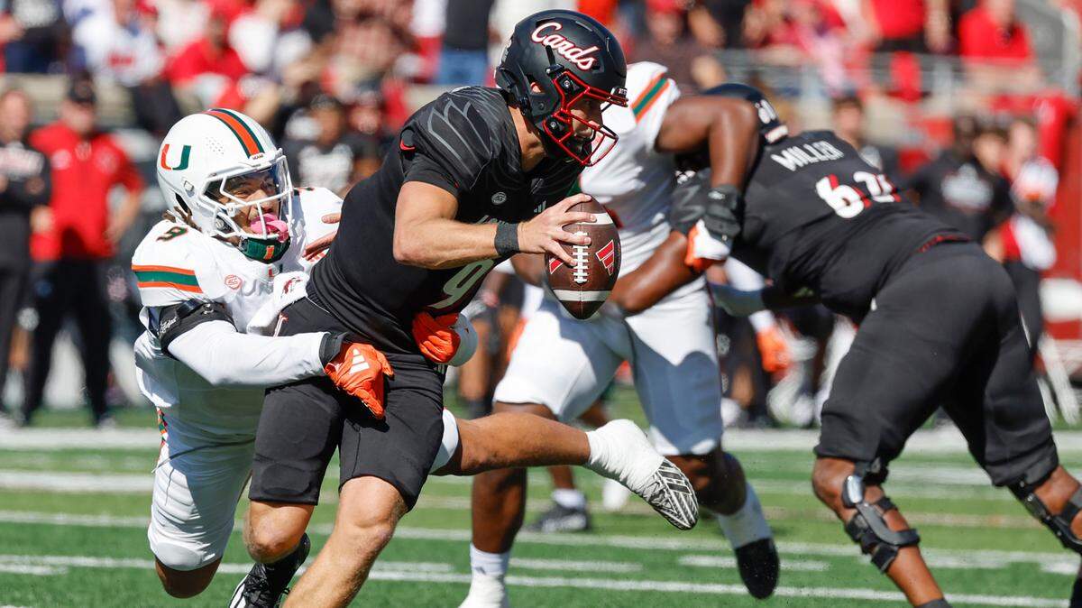 Miami Hurricanes defensive lineman Tyler Baron (9) attempts to sack Louisville Cardinals quarterback Tyler Shough (9) in the first half during an NCAA football game at L&N Federal Credit Union Stadium in Louisville, Kentucky on Saturday, October 19, 2024.
