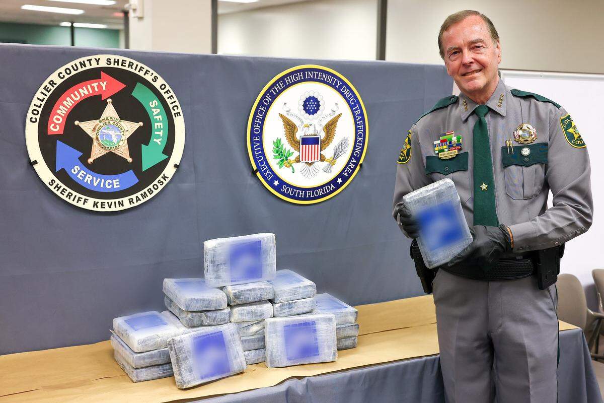 Collier County Sheriff Kevin Rambosk is seen with the 56 pounds of cocaine found by boaters off Florida’s Panther Key.