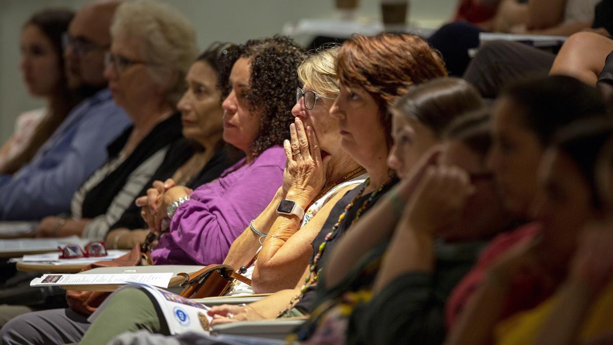 Nursery Teacher Cindy Haralson from The Cushman School reacts to cellphone footage taken inside Marjory Stoneman Douglas High School during the Parkland shooting on February 14, 2018, during an Active Shooter Preparedness Symposium hosted by the Miami Police Shield Detail at the Miami Police College auditorium in Miami, Florida, on Friday, August 23, 2019.