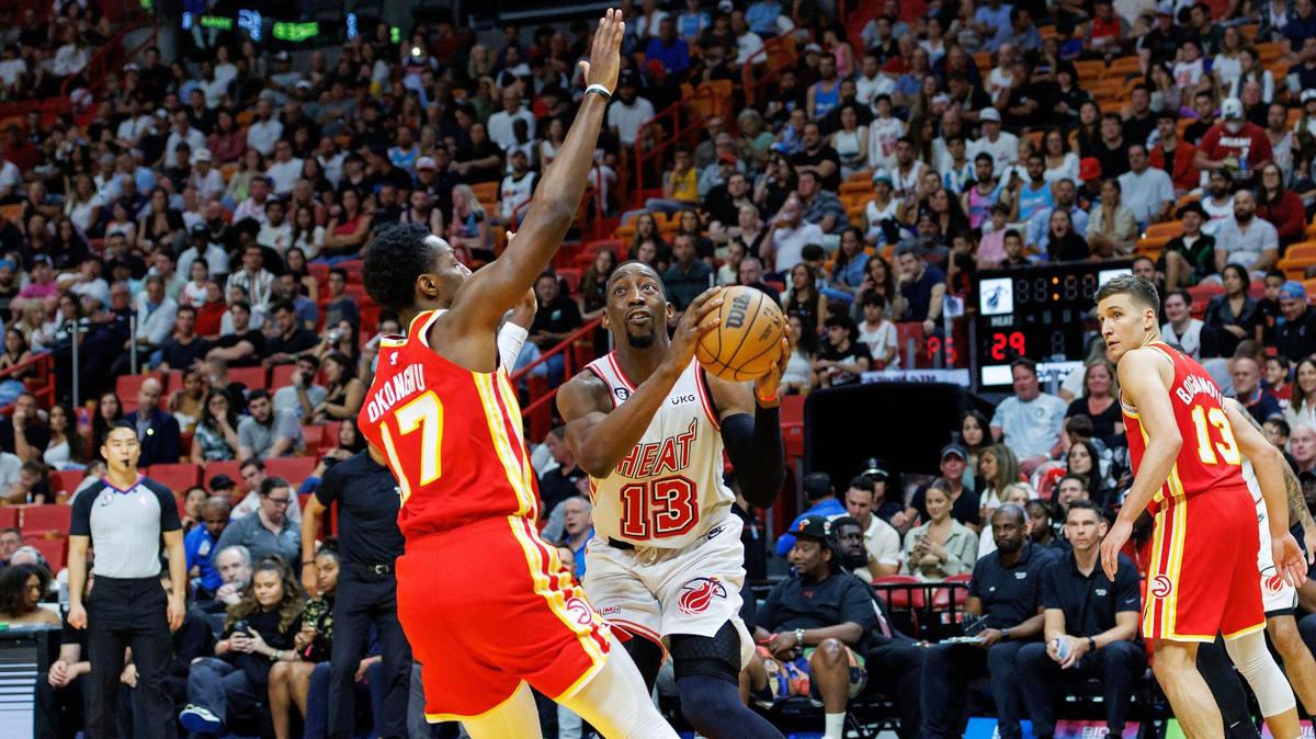 Miami Heat center Bam Adebayo (13) goes to the basket against Atlanta Hawks forward Onyeka Okongwu (17) during the second quarter of an NBA game at Miami-Dade Arena on Saturday, March 4, 2023, in Miami, Florida.