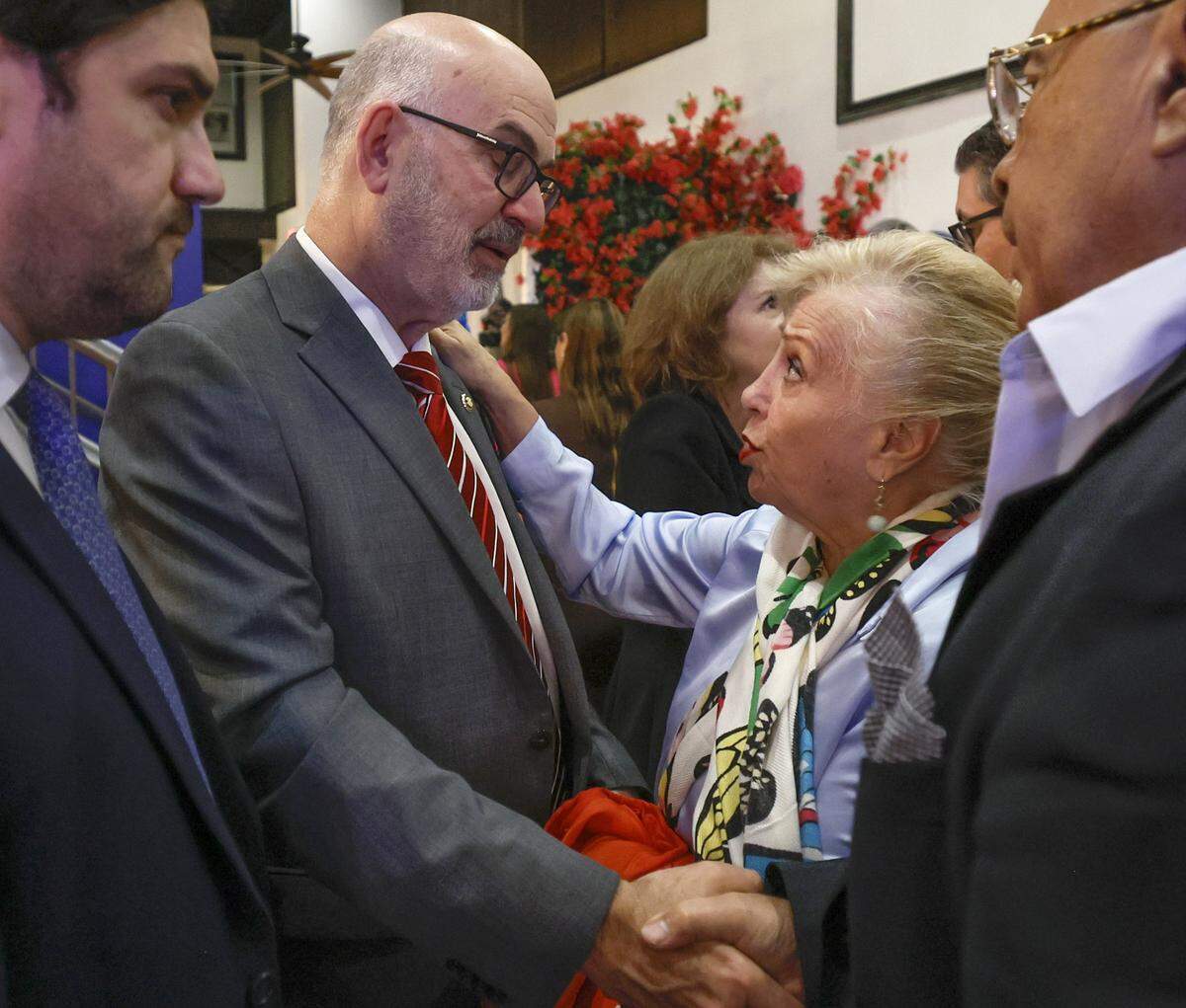 City of Miami mayoral candidate Emilio Gonzalez speaks with Beatriz Quintero Plotkin and supporters after conceding to Eileen Higgins for City of Miami Mayor during election night watch party for the runoff race at Meraki Greek Bistro in Miami, Florida on Tuesday, December 9, 2025. 