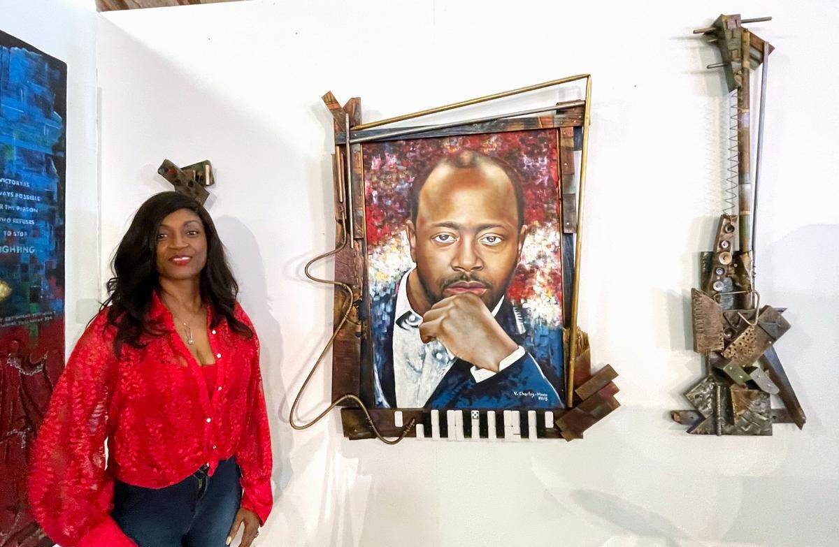 Marie Louissaint will be honoring Haiti-born Grammy winner Wyclef Jean on Saturday, May 20, 2023 during her annual Chefs if the Caribbean celebration in honor of Haitian Heritage Month. A painting of the artist stands inside the iconic Caribbean Marketplace in Little Haiti where Jean will be honored.