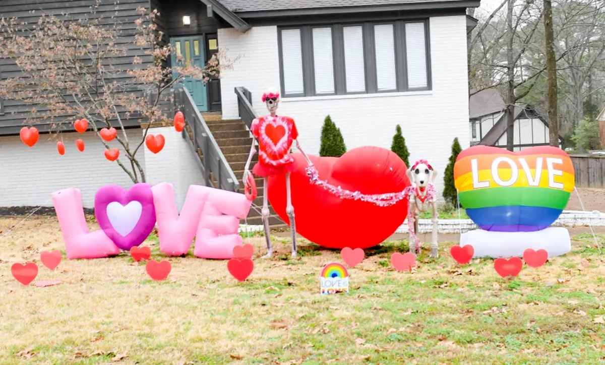 Luttrell’s latest display includes her 8-foot skeleton in a red tutu and a tie die heart alongside the skeletal dog and multiple heart inflatable decorations.