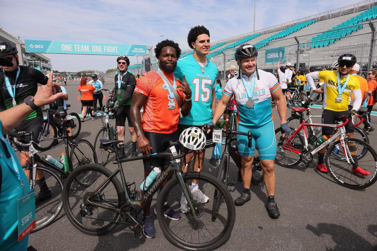 Miami Dolphins linebacker David Long, linebacker Jaelan Phillips, and former Miami Dolphins player Zack Thomas pose for a photo during the Dolphins Challenge Cancer XIV event at Hard Rock Stadium in Miami Gardens, Florida, Saturday, February 24, 2024. The DCC unites the community with 100 percent of participant raised-funds going towards life-saving cancer research at Sylvester Comprehensive Cancer Center.