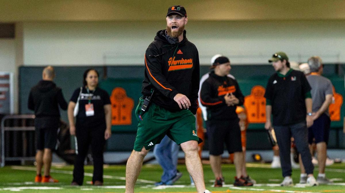 Miami Hurricanes defensive coordinator Corey Hetherman directs players during spring practice at the Carol Soffer Indoor Practice Facility at the University of Miami on Wednesday, March 5, 2025, in Coral Gables, Florida.