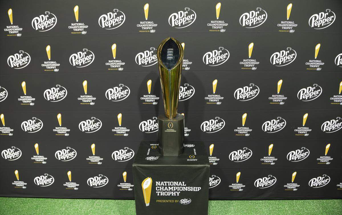 The National Championship Trophy is on display for guests at the Playoff Fan Central at the Miami Beach Convention Center on Friday, Jan. 16, 2025, in Miami Beach, Fla. Fans can visit the event ahead of the College Football Playoff National Championship Game between the Miami Hurricanes and the Indiana Hoosiers and enjoy a variety of family-friendly interactive experiences.