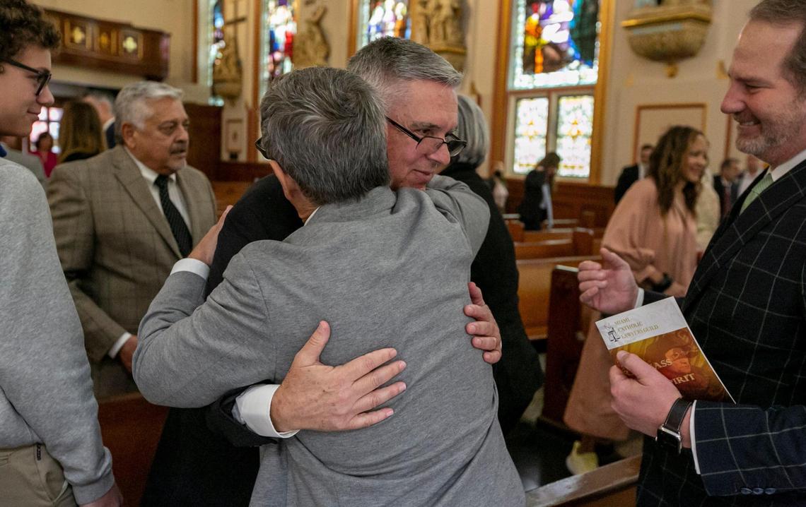 William Castro is congratulated by well-wishers after a mass and ceremony at Gesu Catholic Church in downtown Miami on Thursday, Dec. 1, 2022.