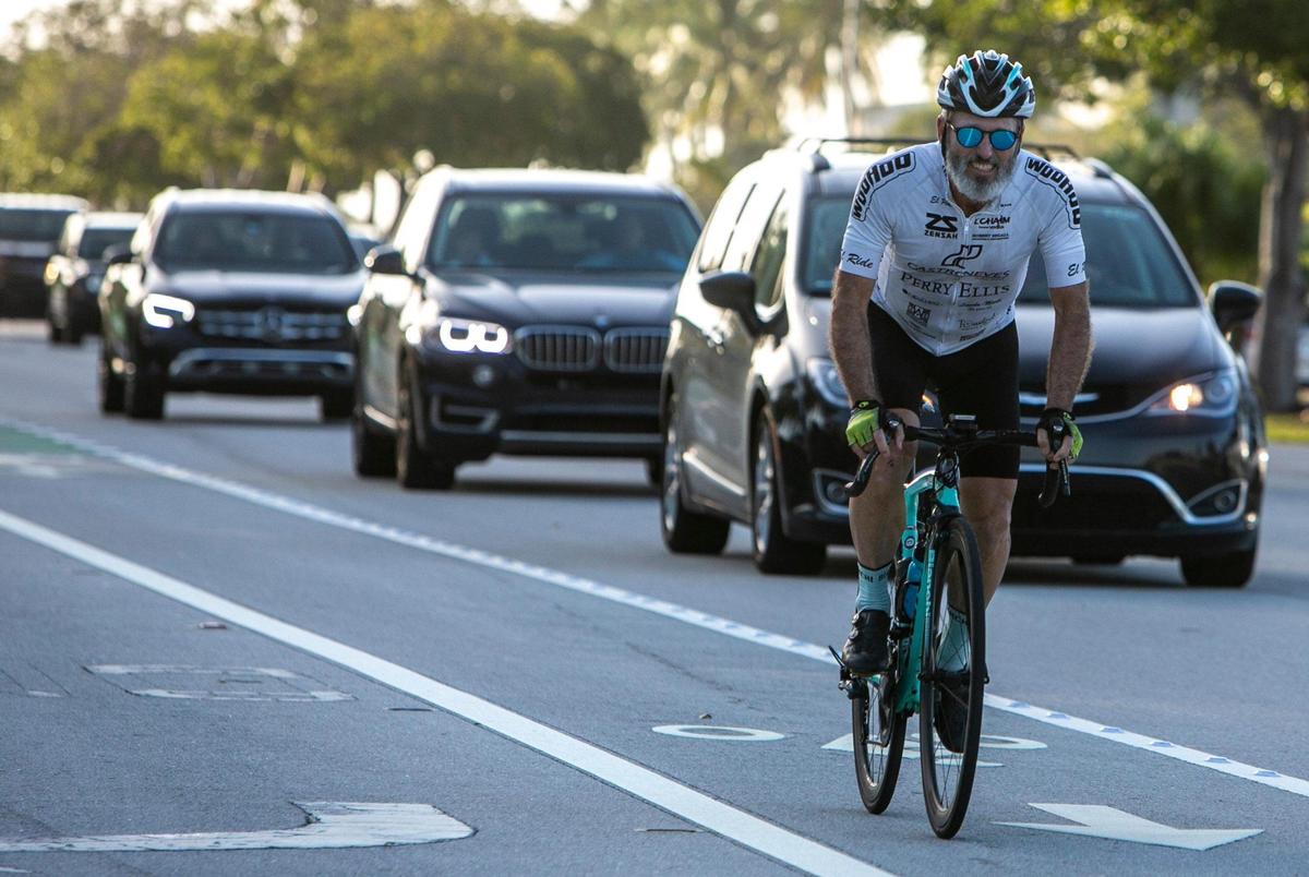 Lee Marks (right) rides nearly every morning on the Rickenbacker Causeway, often passed by cars exceeding 60 mph. A large number of cyclists, runners and walkers have made the stretch of road between Miami and Key Biscayne a very popular recreational route with great risk for accidents.