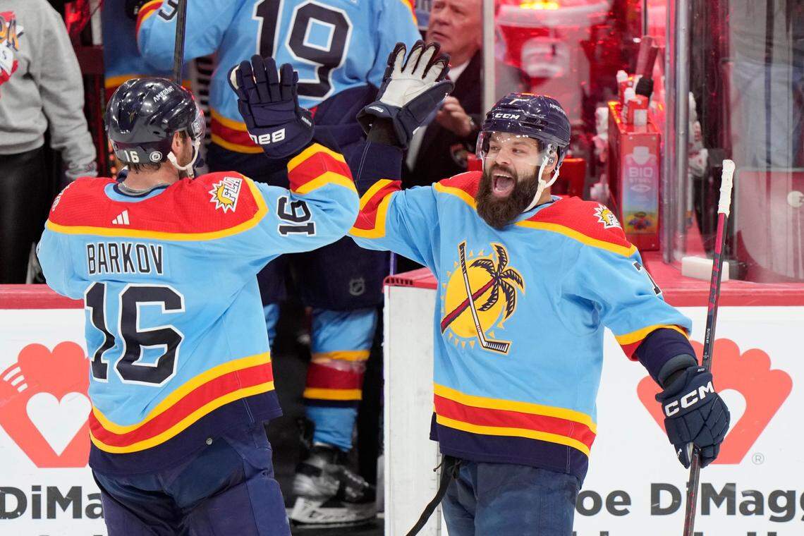 Florida Panthers center Aleksander Barkov (16) and defenseman Radko Gudas (7) congratulate each other after the Panthers beat the Boston Bruins 4-3 in an overtime period of an NHL hockey game, Saturday, Jan. 28, 2023, in Sunrise, Fla. (AP Photo/Wilfredo Lee)
