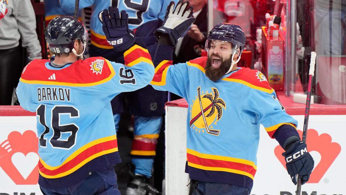 Florida Panthers center Aleksander Barkov (16) and defenseman Radko Gudas (7) congratulate each other after the Panthers beat the Boston Bruins 4-3 in an overtime period of an NHL hockey game, Saturday, Jan. 28, 2023, in Sunrise, Fla. (AP Photo/Wilfredo Lee)