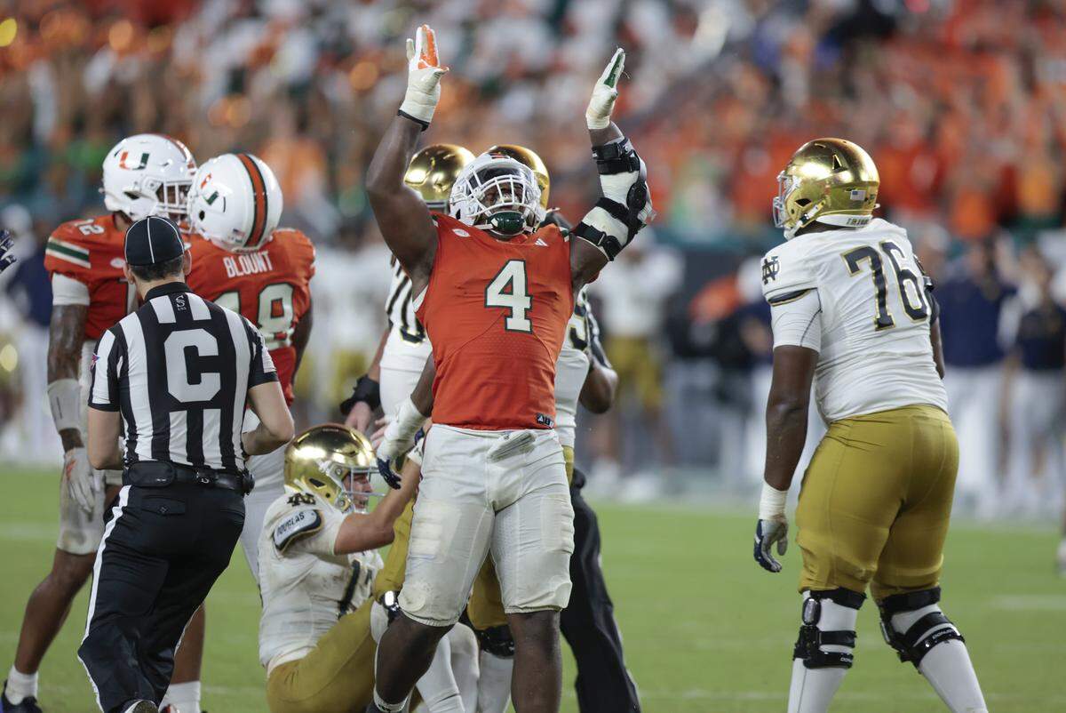 Miami Hurricanes defensive lineman Rueben Bain Jr. (4) ceelbrates after sacking Notre Dame Fighting Irish quarterback CJ Carr (13) of an NCAA football game at Hard Rock Stadium in Miami Gardens, Florida, on Sunday, August 31, 2025.
