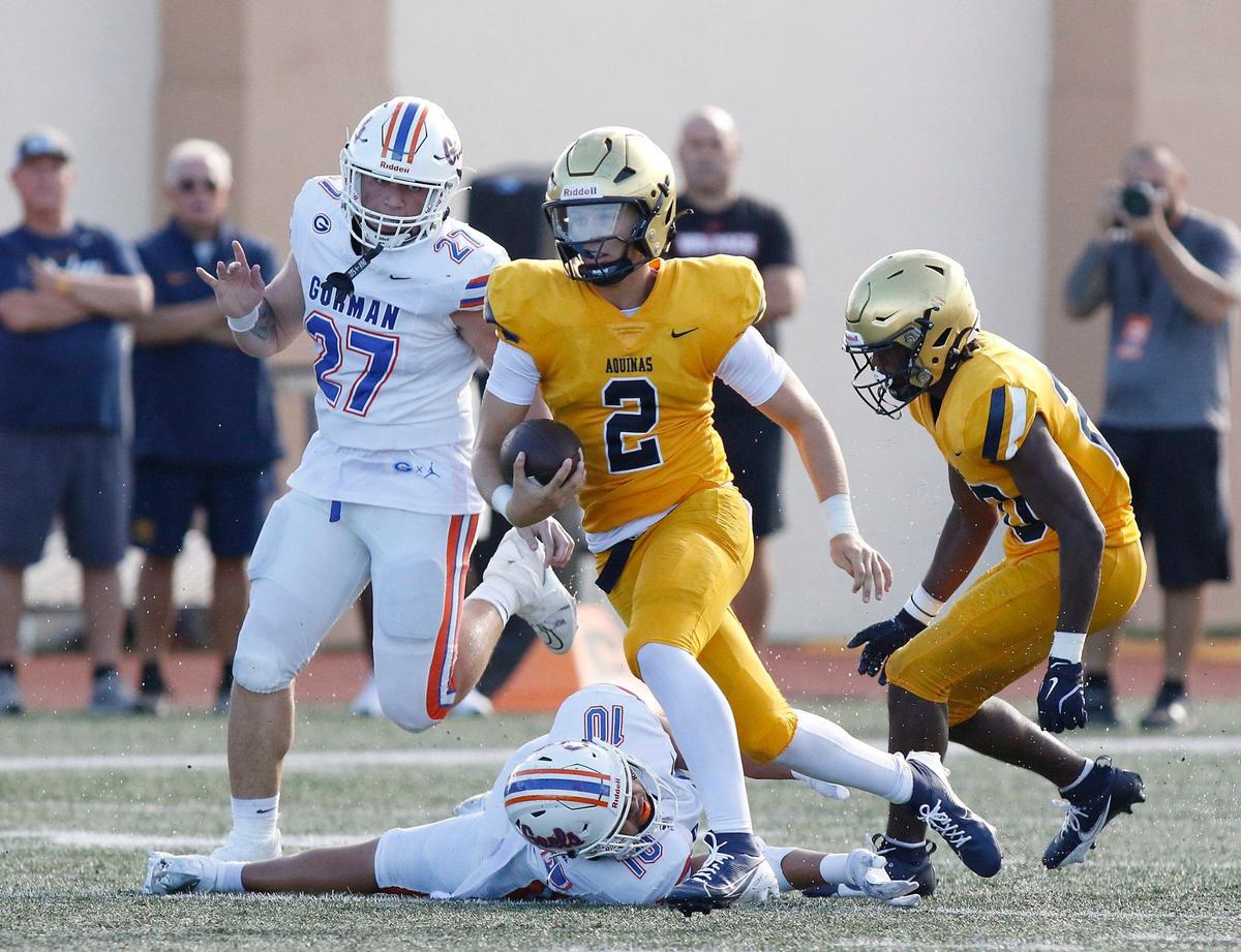St. Thomas Aquinas quarterback Andrew Indorf (2) carries the ball against Las Vegas Bishop Gorman during football game on Saturday, August 24, 2024 at St. Thomas Aquinas HS in Fort Lauderdale.