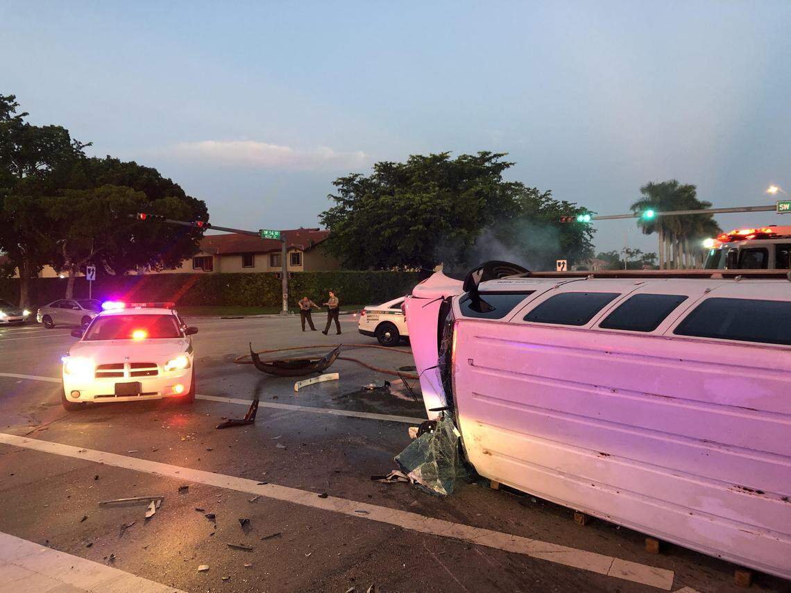 A private school bus is left overturned on Miller Drive following a crash early Friday morning. Seven students were inside the van.