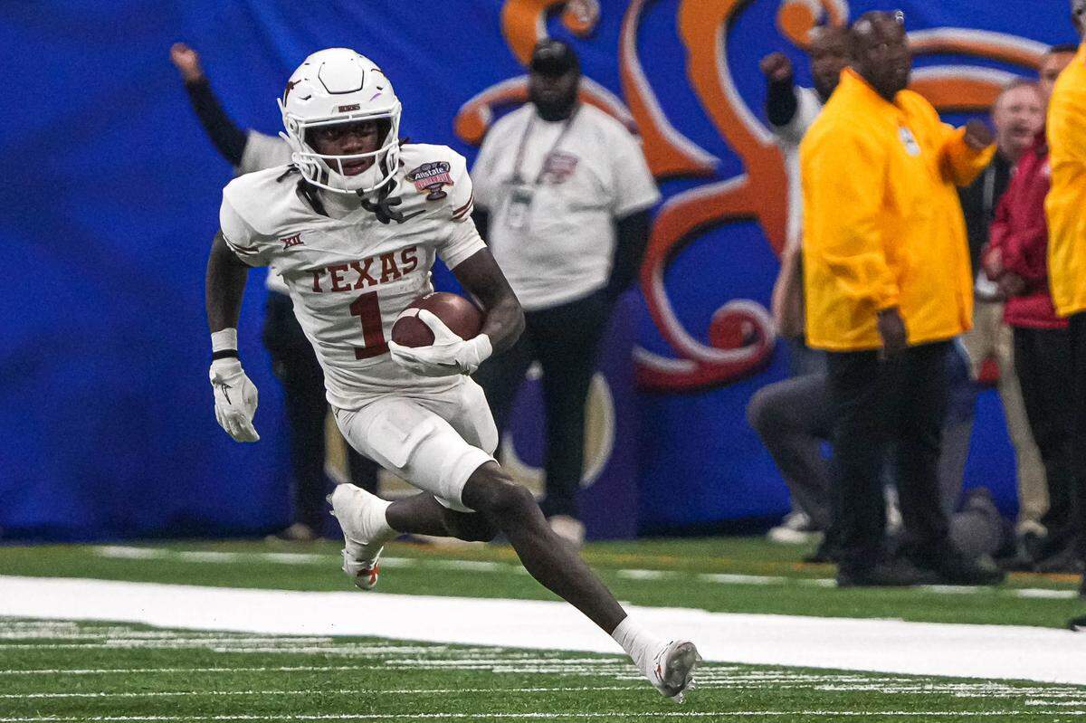 Texas Longhorns wide receiver Xavier Worthy (1) runs the ball during the Sugar Bowl College Football Playoff&nbsp;semifinals game against the Washington Huskies at the Caesars Superdome on Monday, Jan. 1, 2024 in New Orleans, Louisiana.