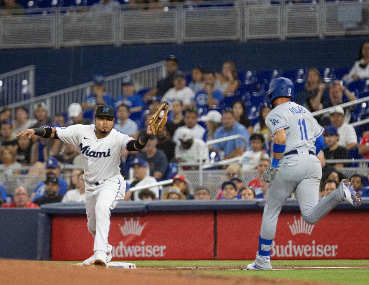 Miami Marlins first baseman Luis Arraez (3) gets Los Angeles Dodgers shortstop Miguel Rojas (11) out at first base during the second inning of a baseball game on Wednesday, Sept. 6, 2023, at loanDepot Park in Miami.