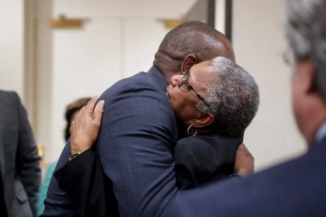 Carol Greenlee, daughter of Charles Greenlee, one of the four men in the Groveland Four, hugs state Rep. Bobby Dubose, after her father was pardoned by Gov. Ron DeSantis and his cabinet during a clemency board hearing at the Florida State Capitol on Jan. 11.